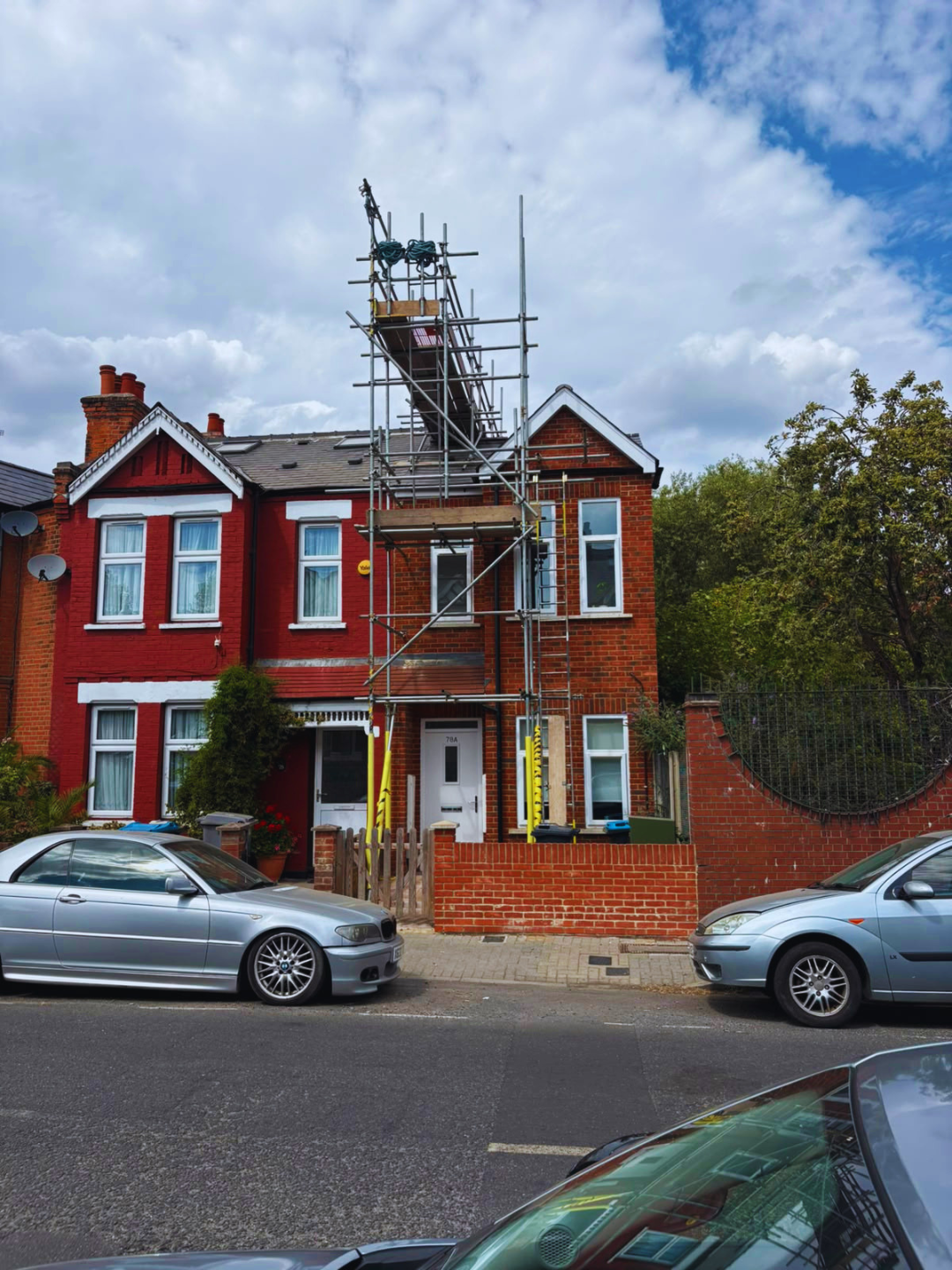 Chimney scaffolding to a red brick semi